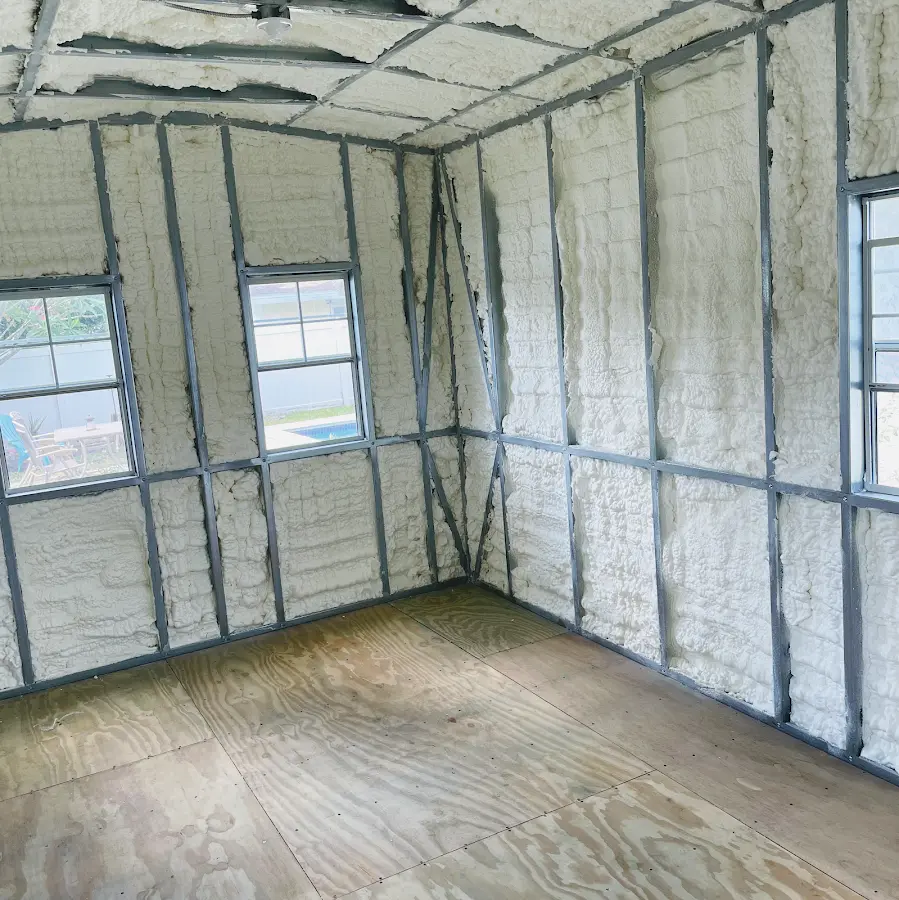 Closed-cell spray foam insulation applied to wall cavities in a residential project in Hampden